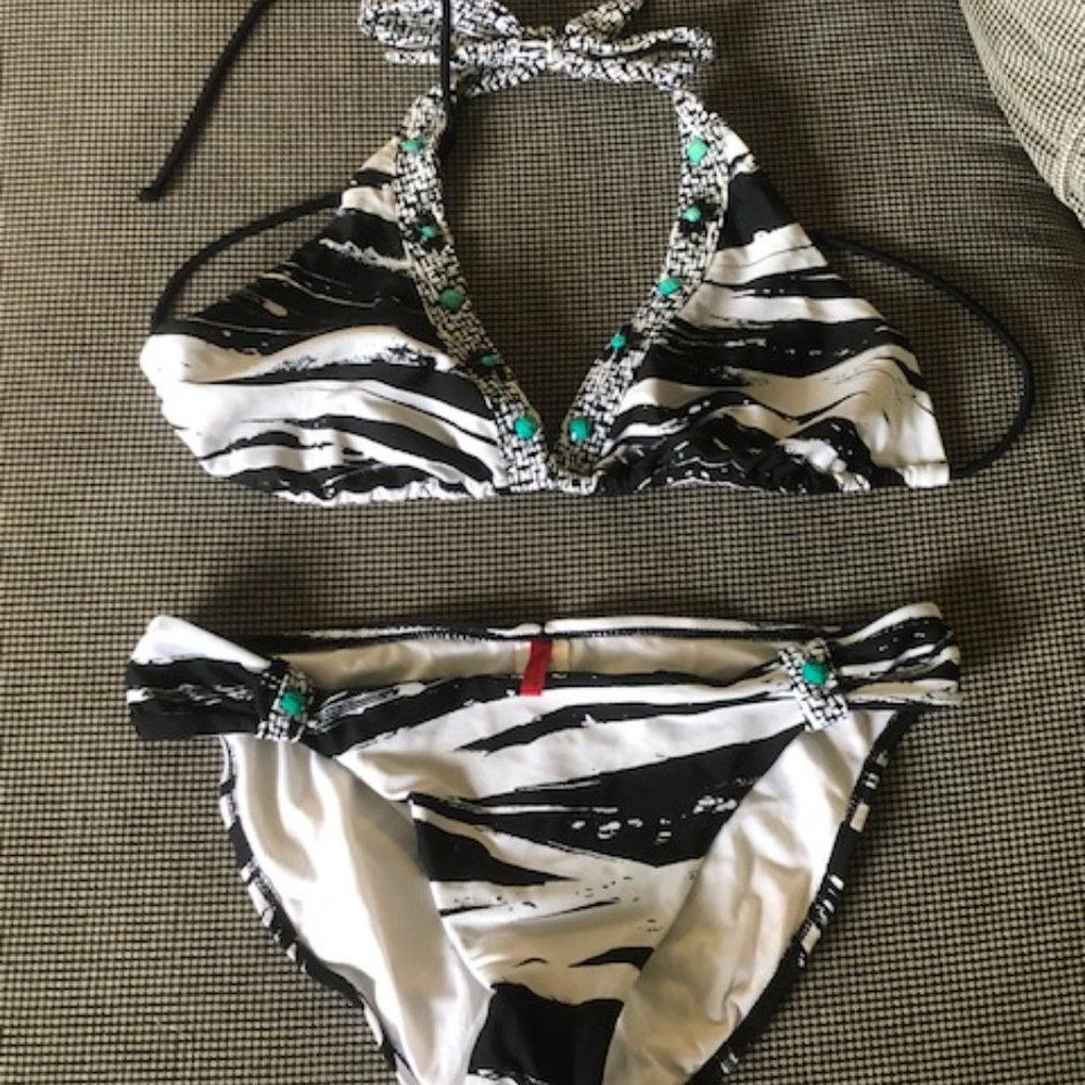Two-piece zebra striped swimsuit with turquoise "jewels" attached. Size L.